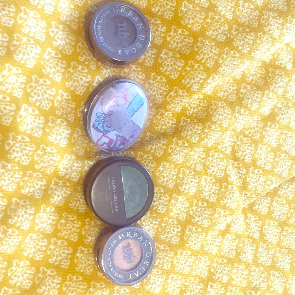 Four gently used single eye shadow colors